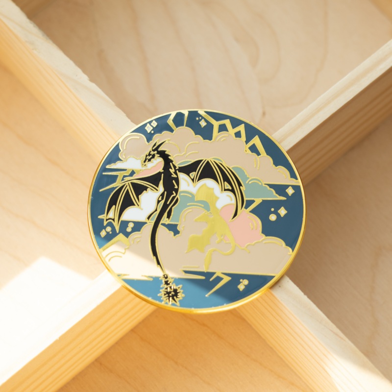 Wings in the Storm Enamel Pin